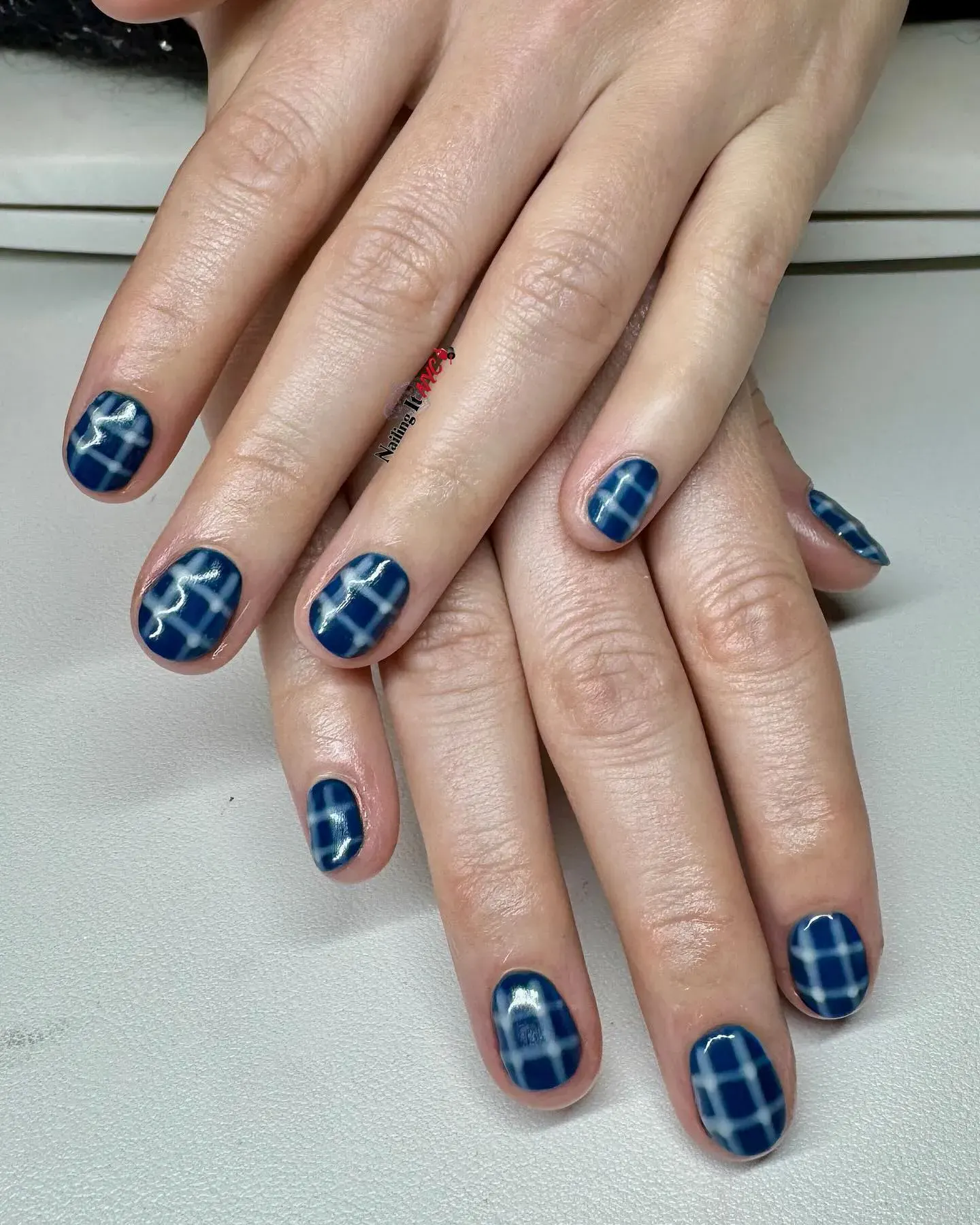 Moody blue plaid with a glossy finish that looks straight out of a cozy flannel shirt. Simple, stylish, and seasonless.