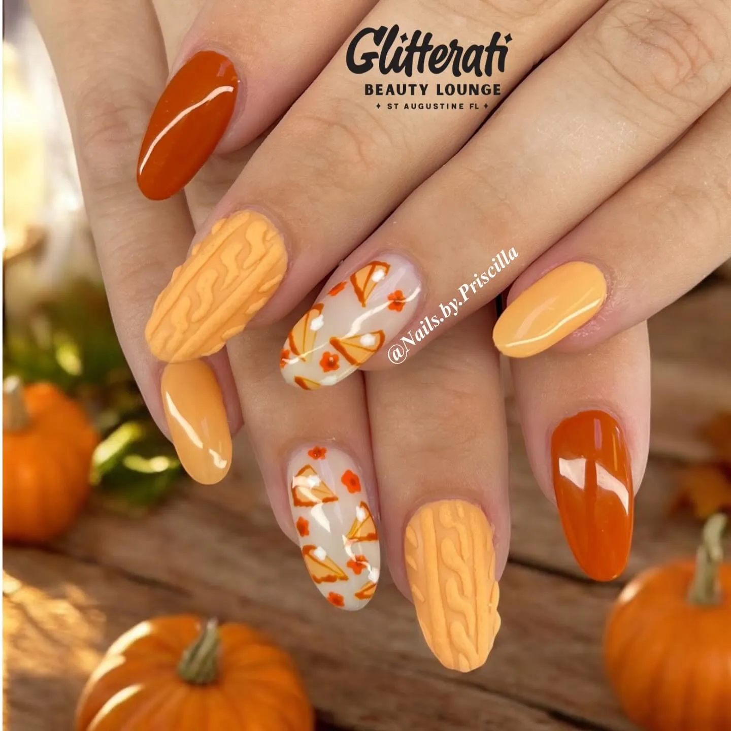 @nails.by.priscillaWarm pumpkin tones and soft cable-knit accents make these nails feel like a pumpkin-spice latte in manicure form. Add in a few floral details and you’ve got simple fall nails that are perfect for Thanksgiving dinner.