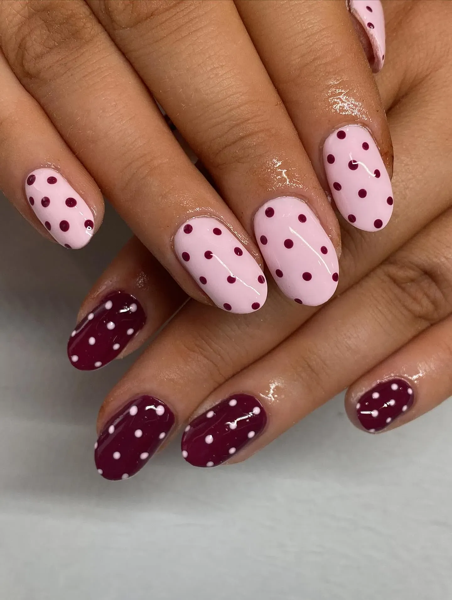 Soft pink meets berry red in a dotted pattern that feels girly but grown-up — perfect for transitioning from summer to fall.