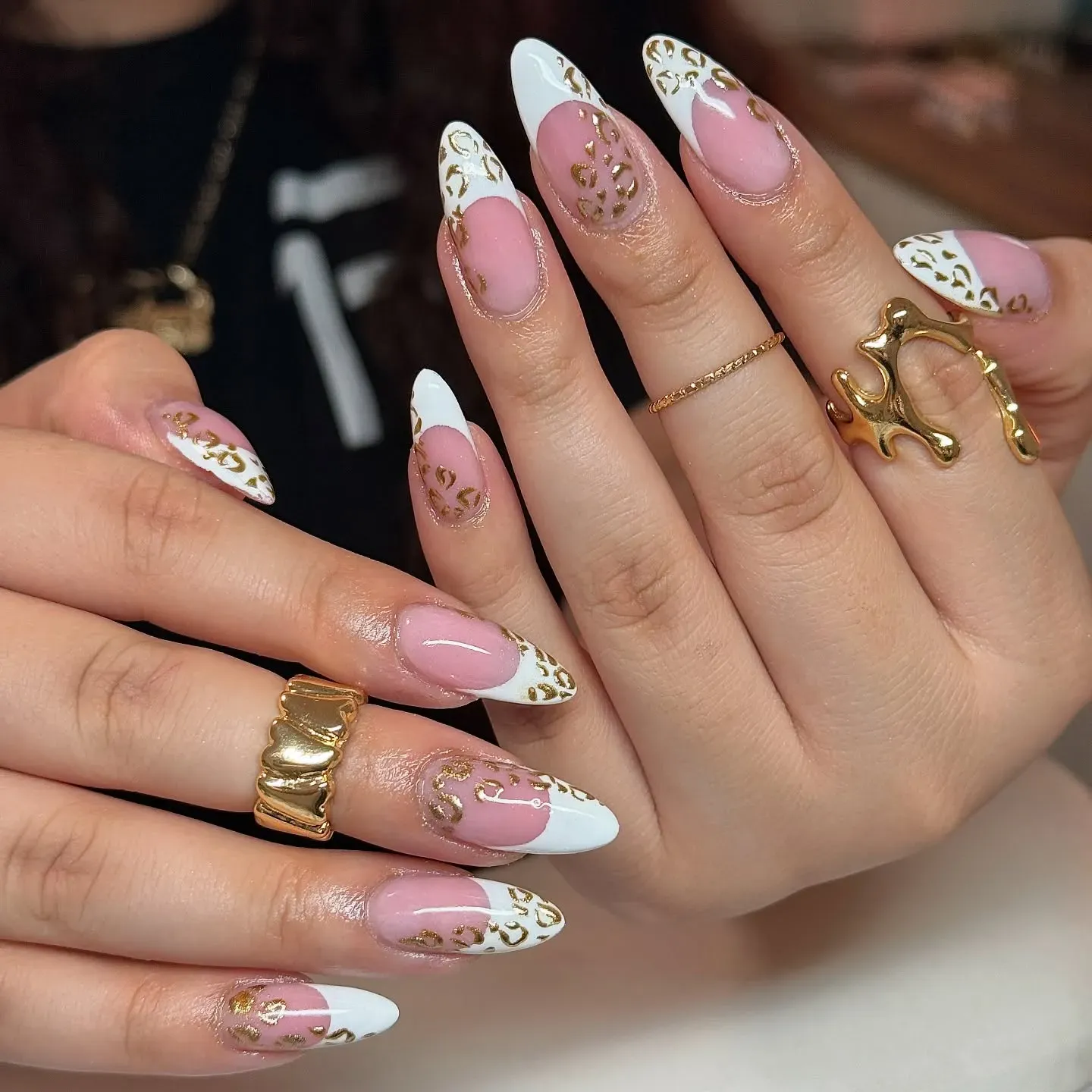 A fresh twist on French nails — these gold leopard print tips with white edging and blush bases are ultra-stylish. They’re modern, elegant, and totally wearable for special events or weddings.