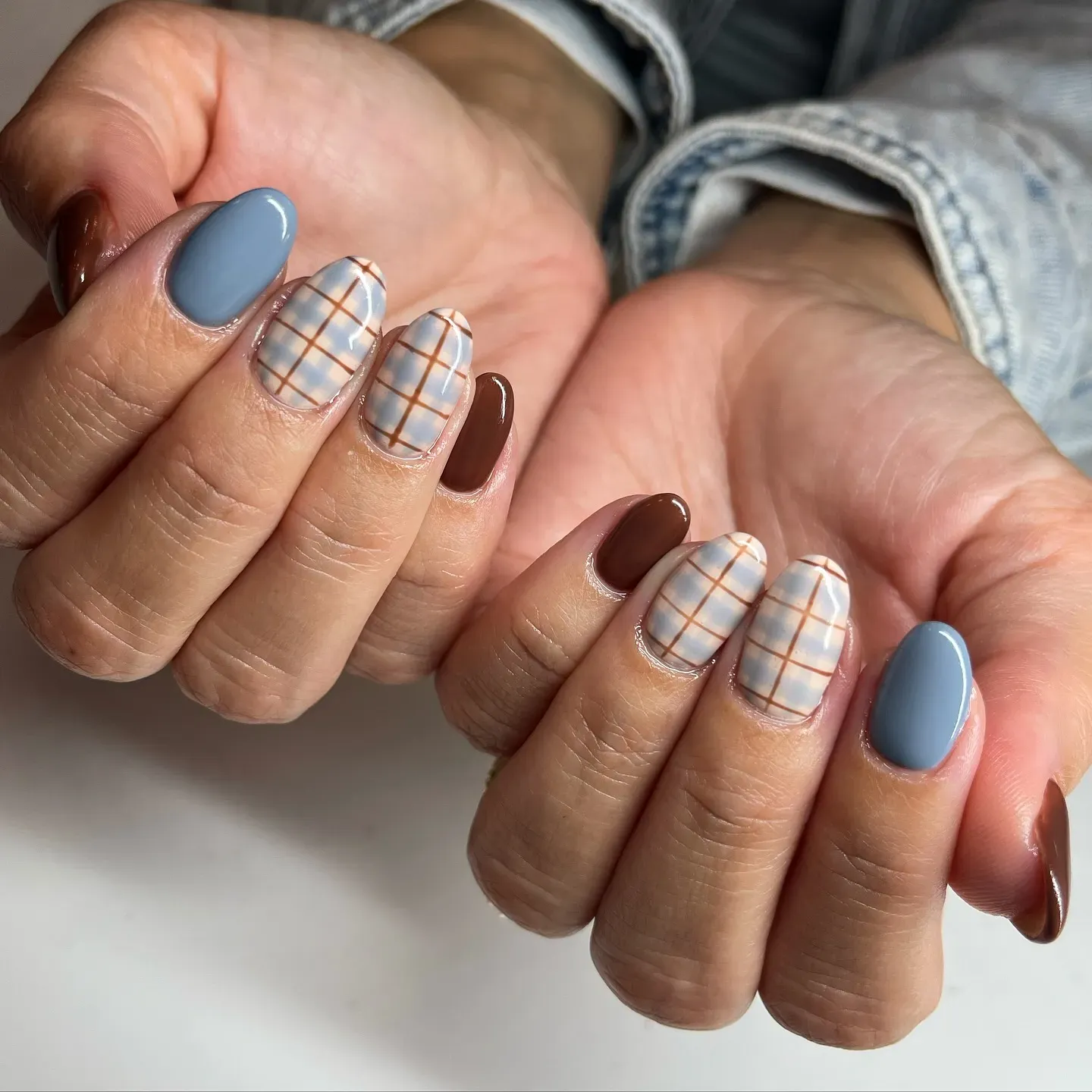 Soft and wearable, this mix of latte brown and slate blue plaid is perfect for a neutral fall manicure that still feels stylish.
