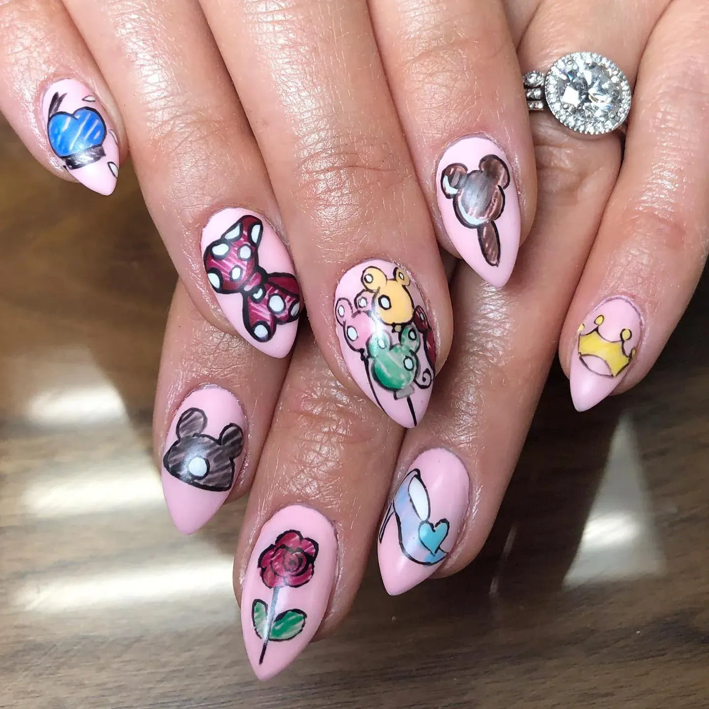 These hand-painted nails capture the cutest Disney details β from Mickey-shaped snacks to Minnie bows and royal touches.