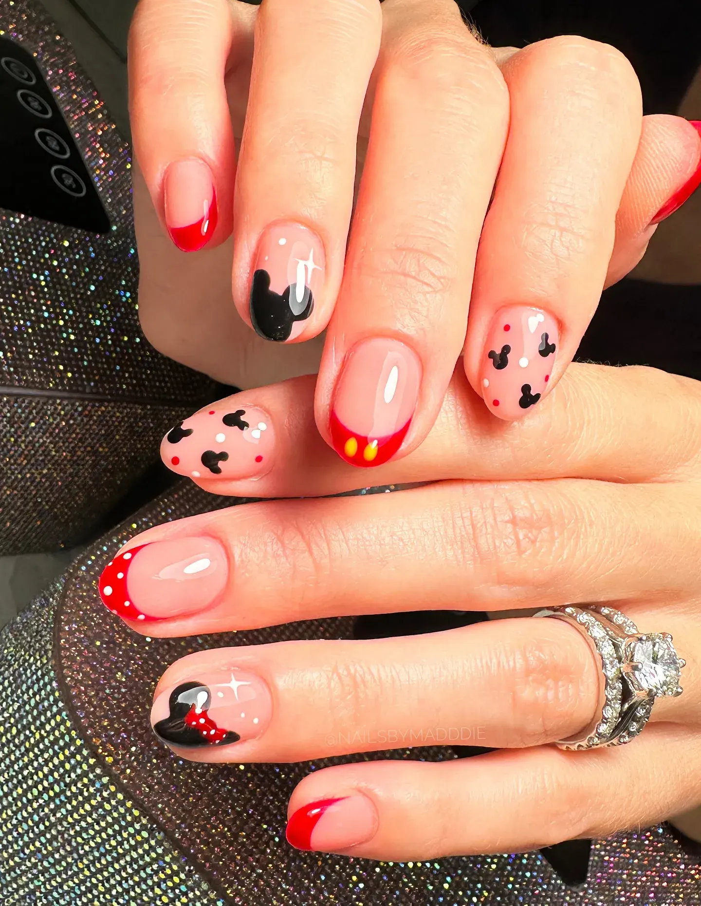 Short and chic with red French tips, polka dots, and hidden Mickeys — a low-maintenance design that still brings the Disney magic.