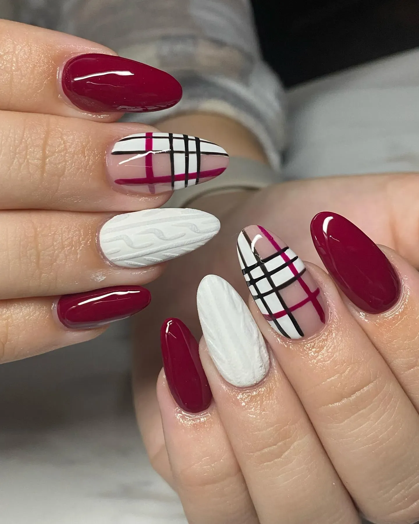 Rich cranberry red with a cozy cable-knit accent and crisp white stripes — this look feels like your favorite winter sweater in nail form.