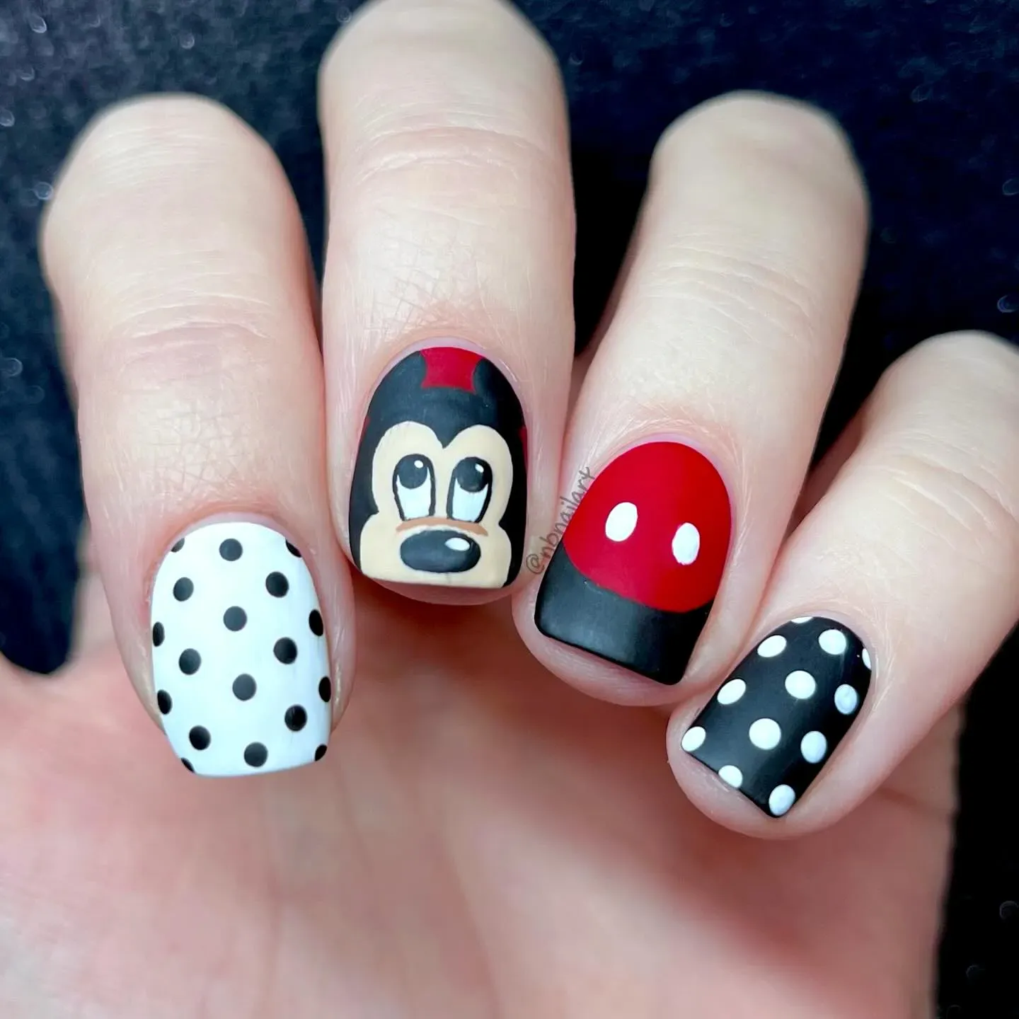 Retro black, white, and red with a hand-painted Mickey face — these nails are the definition of classic Disney style.