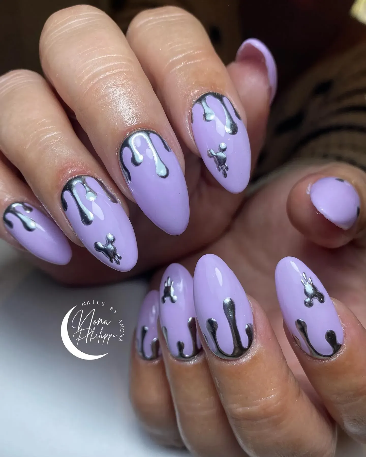 For a modern twist, this lavender mani with silver drips hides tiny Mickey shapes in the chrome finish. Subtle but still Disney-themed perfection.
