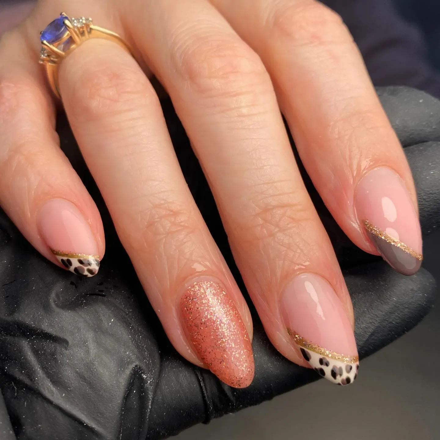 Soft, subtle, and oh-so-pretty — these nude cheetah nails pair rose gold glitter with dainty cheetah tips for a delicate yet trendy vibe. Perfect for work or a special occasion.