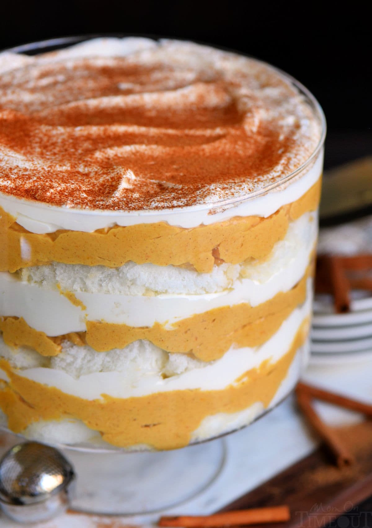 This trifle is the perfect mix of fall flavors with a Halloween twist! Creamy layers of pumpkin cheesecake are alternated with ginger snap crumbs and fluffy whipped cream. This dessert is a delightful mix of sweet, tangy, and spiced – perfect for any fall gathering or Halloween party.