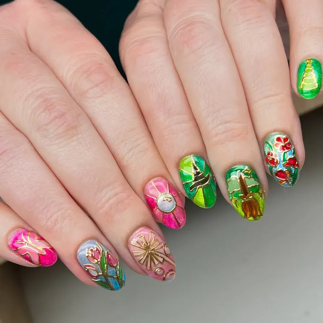 A rainbow of pinks and greens inspired by Oz’s stained-glass glow — look closely for the broomstick, poppies, and enchanted clock!