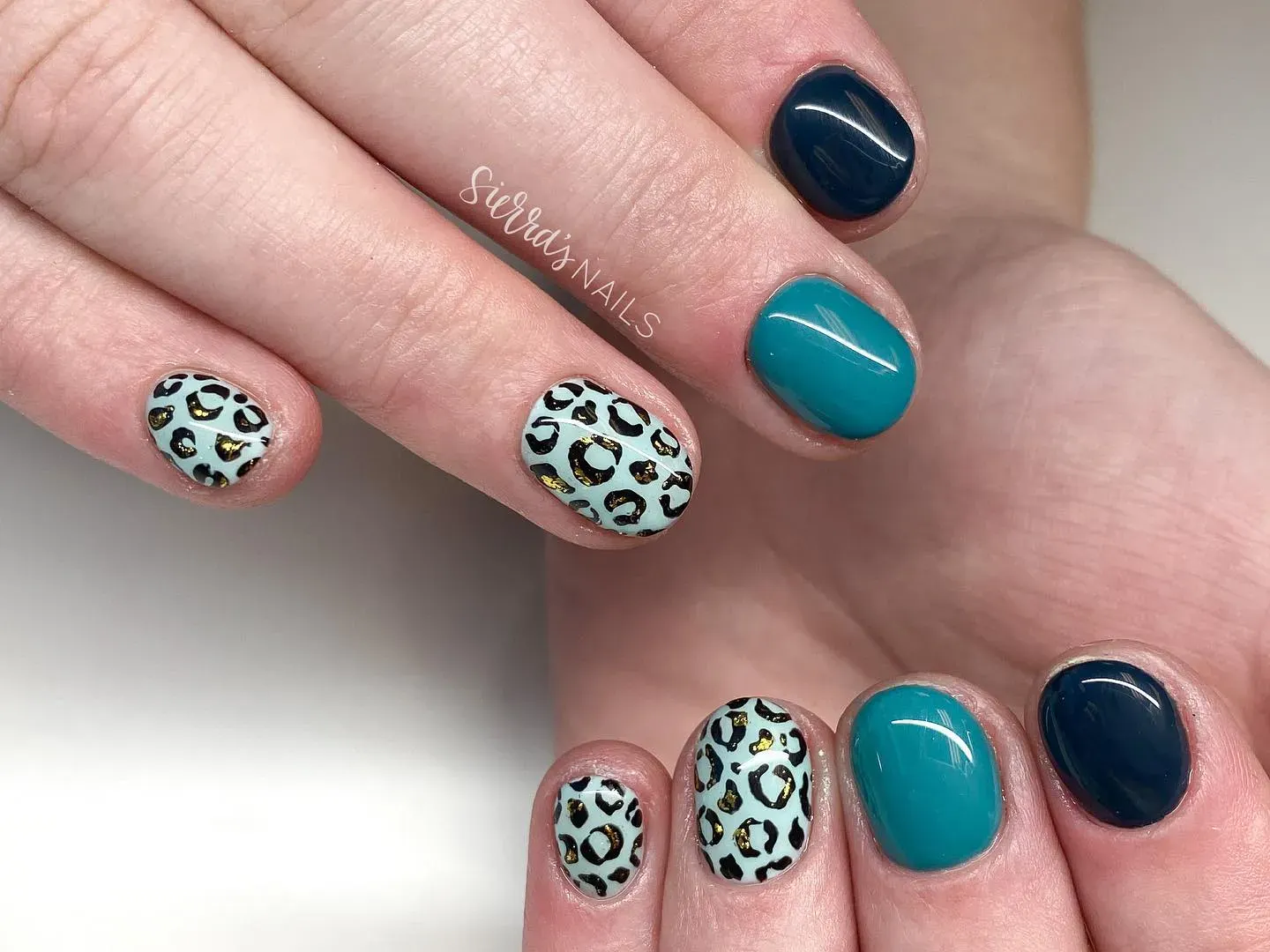If you want something different, try these blue cheetah print nails with teal and navy polish. The pop of gold inside the leopard spots adds just enough glam to make them stand out.
