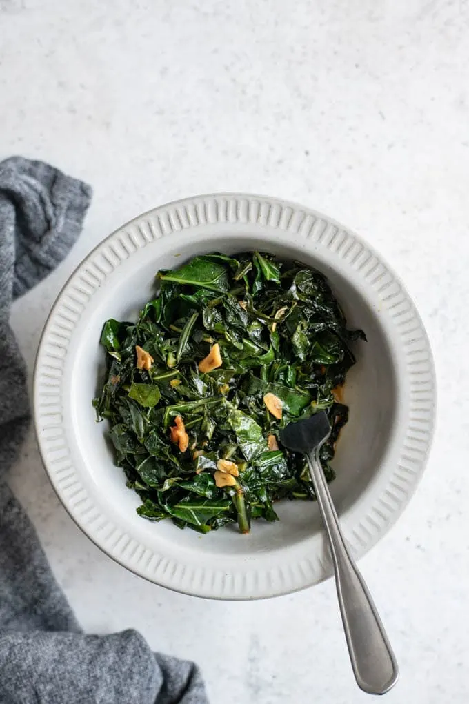 Slow-cooked collard greens with liquid smoke and veggie broth are a delicious, meat-free twist on this classic side that’s hearty enough to stand alone.