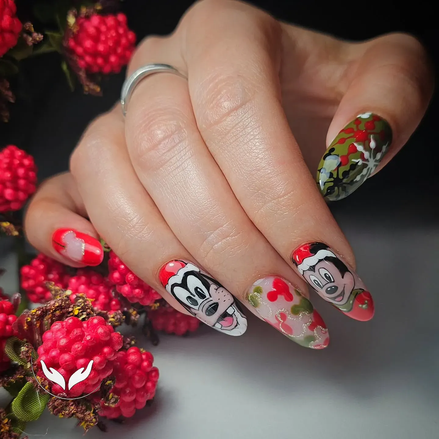 Christmas at Disney? These adorable nails featuring Mickey, Goofy, and festive holly details are full of cheerful, cozy holiday spirit.