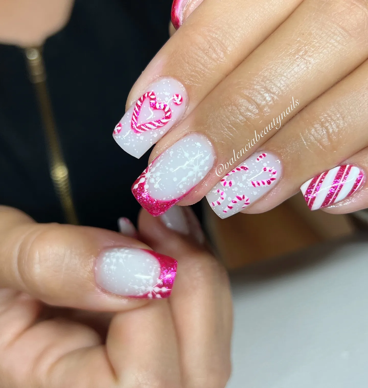 Candy cane hearts, pink glitter tips, and snowflake accents make this set the ultimate Pink Christmas Nail Idea. It’s festive, sweet, and perfect if you’re after pretty winter nails with a fun twist.