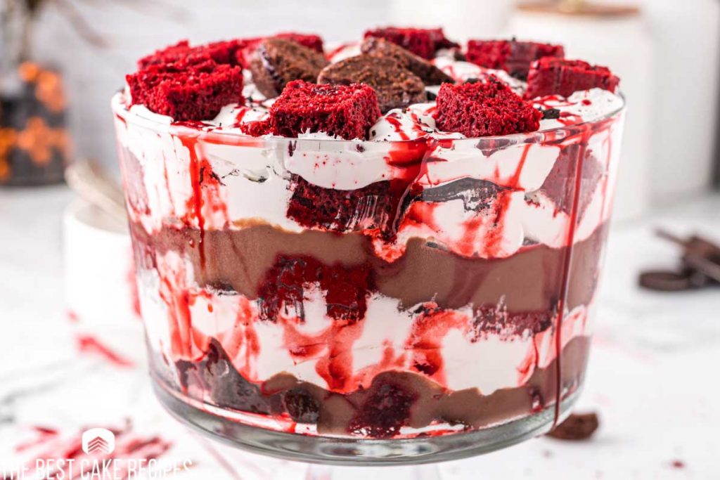 Get ready to sink your teeth into this chillingly delicious dessert! With blood-red cherry pie filling, chocolate cake layers, and creamy pudding, this trifle oozes spooky vibes. Topped with whipped cream and eerie decorations, it’s a must-have for your next Halloween bash.