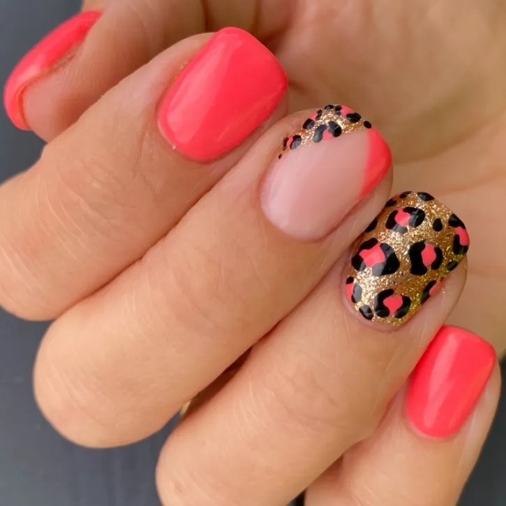 This eye-catching mix from @zeeceebeauty features hot coral nails paired with accent nails in glittery gold leopard print — and one cute Frenchie with a print cut-out. It’s the perfect mix of bold and glam.